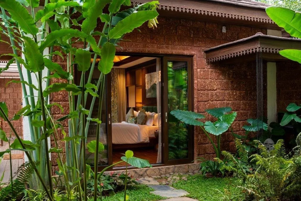 The Leela Coorg Forest Sanctuary — a private villa opening onto a lush forest garden, Coorg