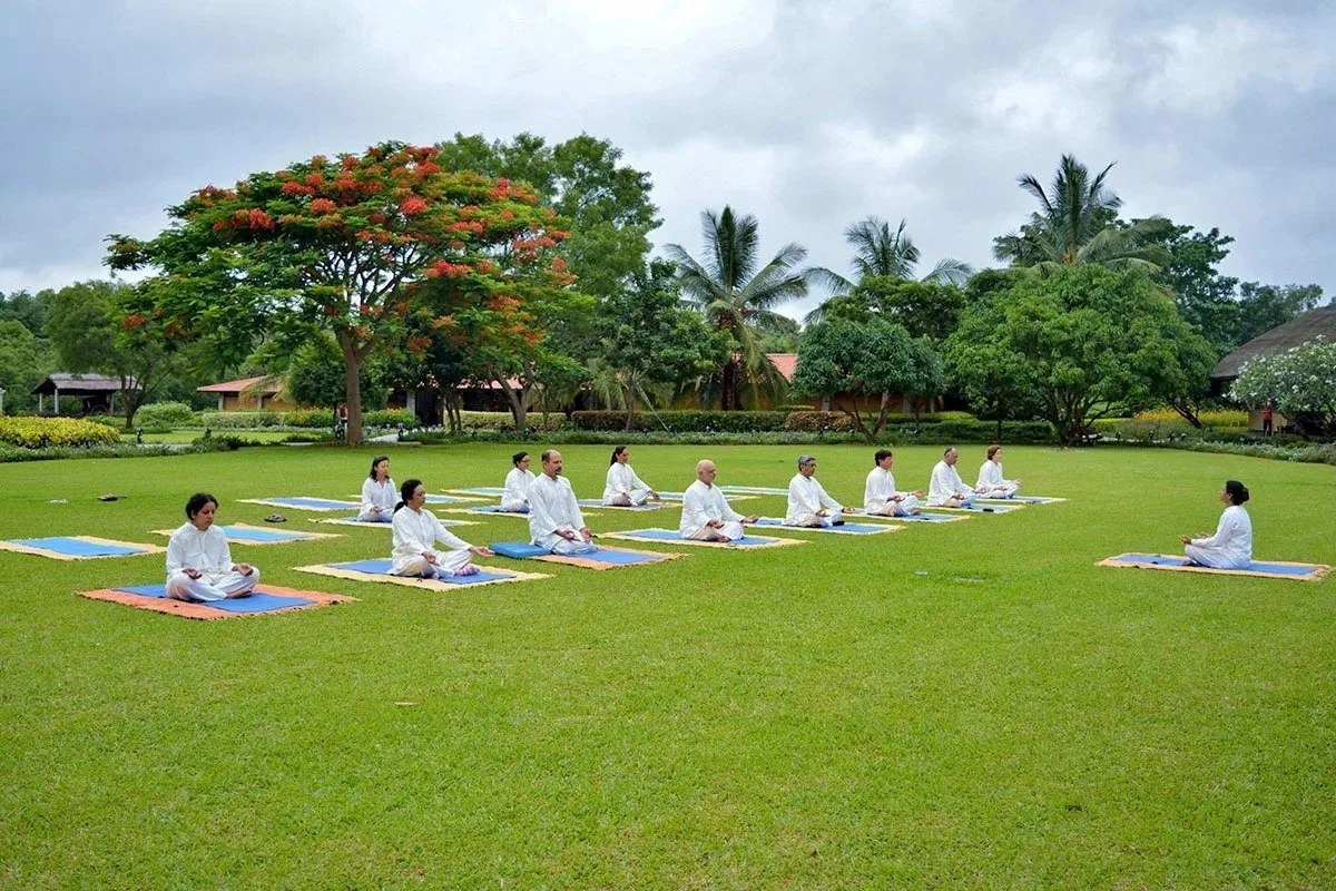 Soukya — a guided yoga session on the open lawn of the garden estate outside Bengaluru