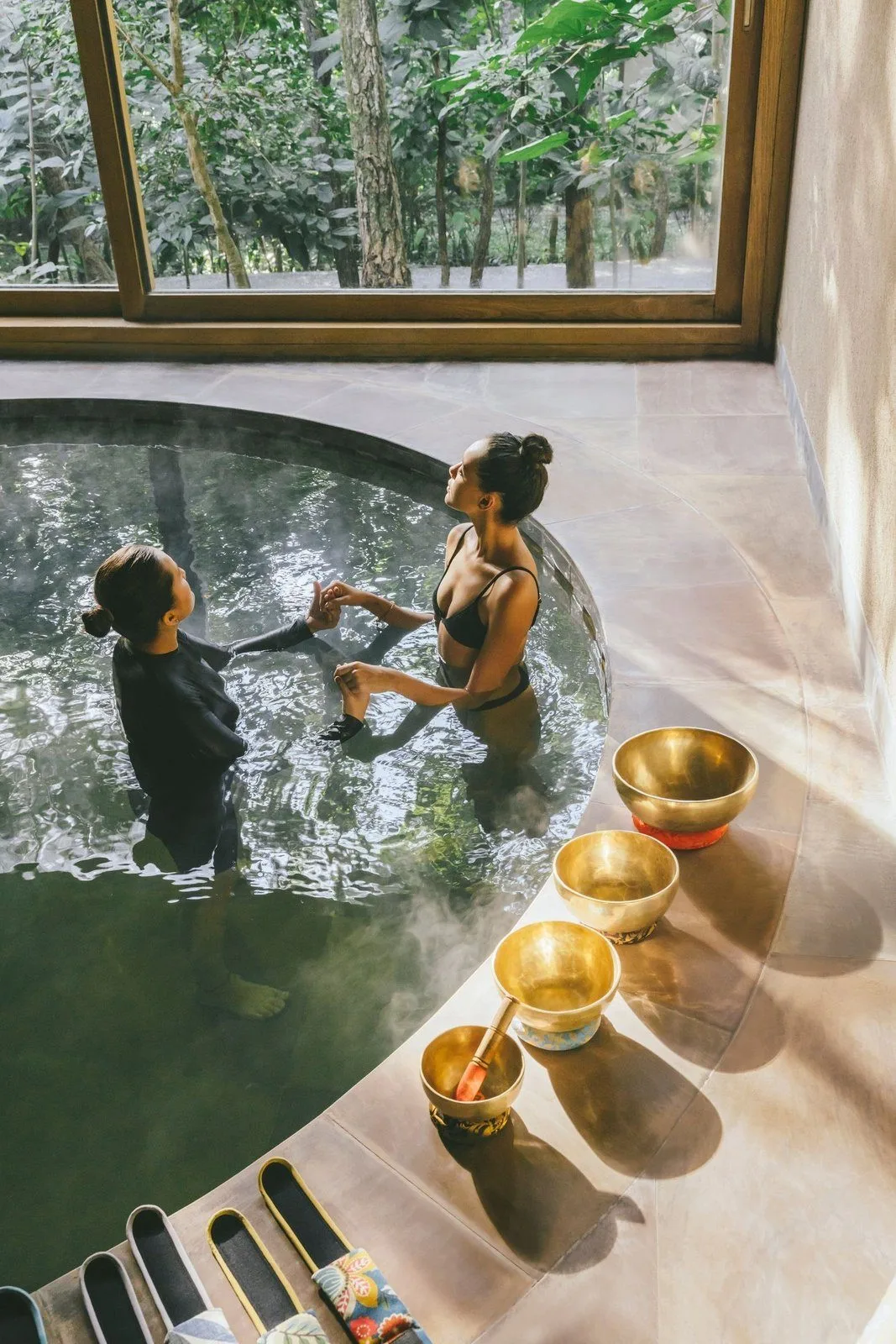 Six Senses Vana — a forest-facing soaking pool with singing bowls at the water's edge
